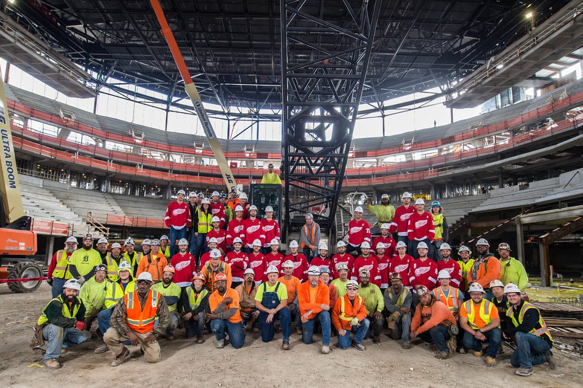 oval stadium with construction worker group photo