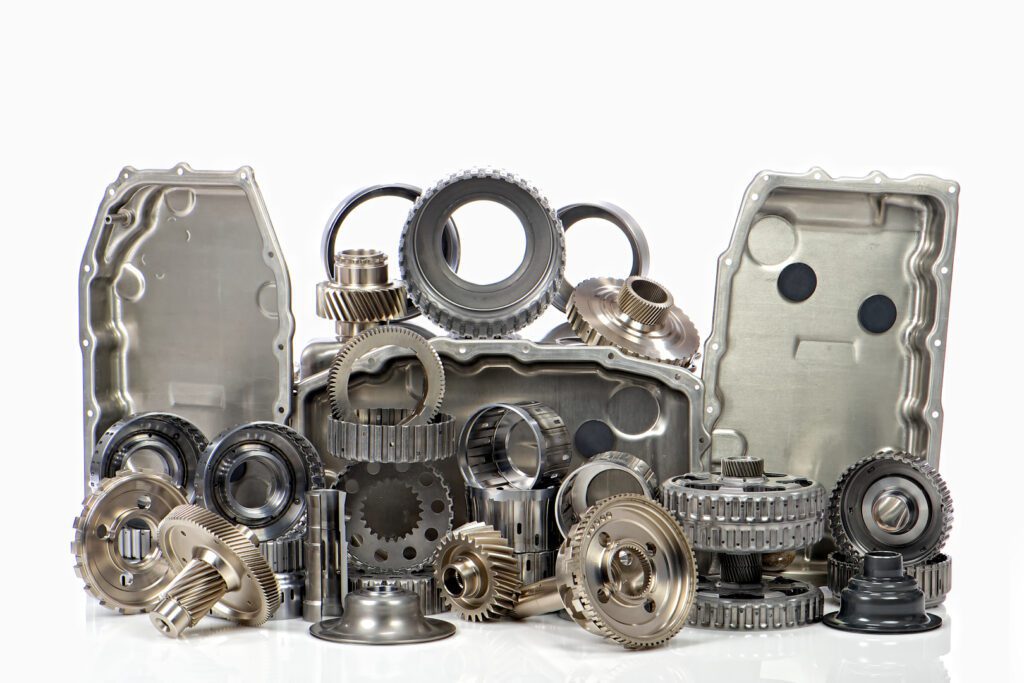 A variety of metal gears and mechanical parts.